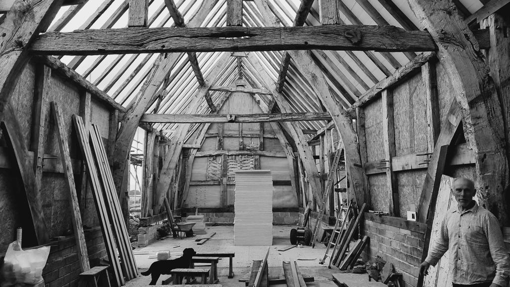 Graham in his Cruck Framed barn conversion that he is converting as his forever home